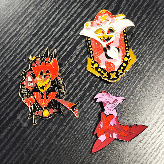 Three enamel pins with unique cartoon characters. Bright colors, detailed designs. Ideal for decorating bags/clothes.