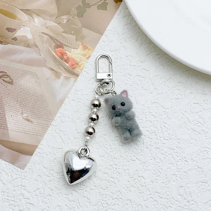 ZAKOL Cute Flocking Cat Keychain 3D Love Phone Pendant Headphone Charm Bag Decor Car Key Ring Jewelry Gift